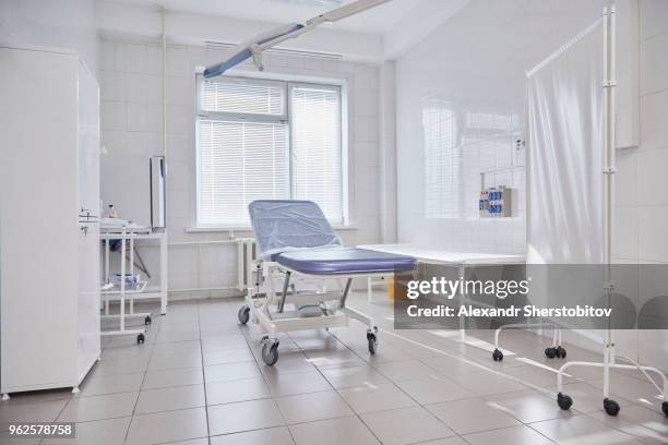 hospital gurney by window in empty ward - sherstobitov stock pictures, royalty-free photos & images