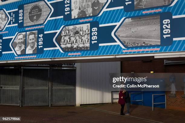 Couple kissing under a display dedicated to the home club's history before Blackburn Rovers played Shrewsbury Town in a Sky Bet League One fixture at...