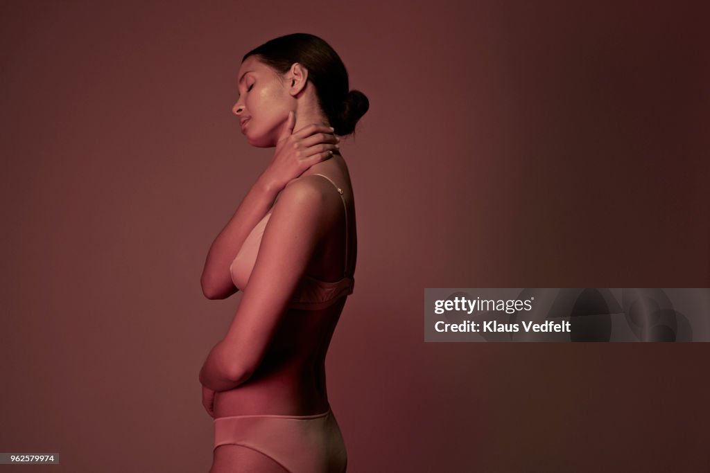 Side view of woman having shoulder and neck pain