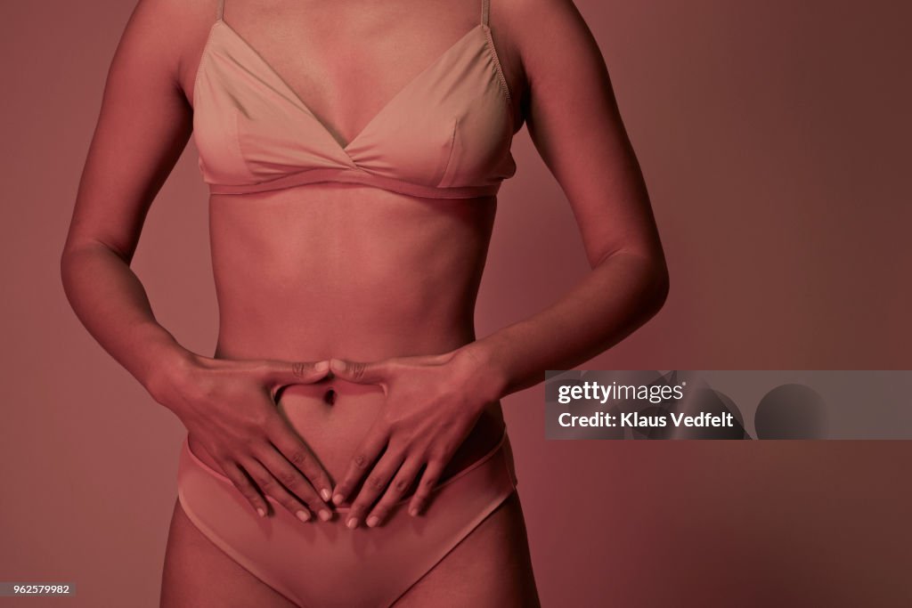 Young woman having stomach ache