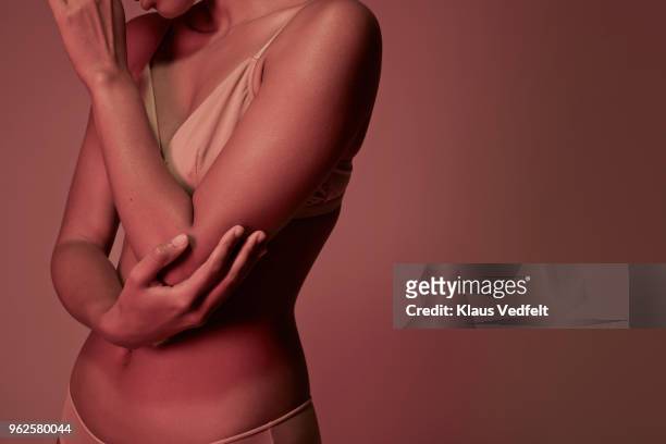 cropped image of woman having elbow pains - elbow stockfoto's en -beelden
