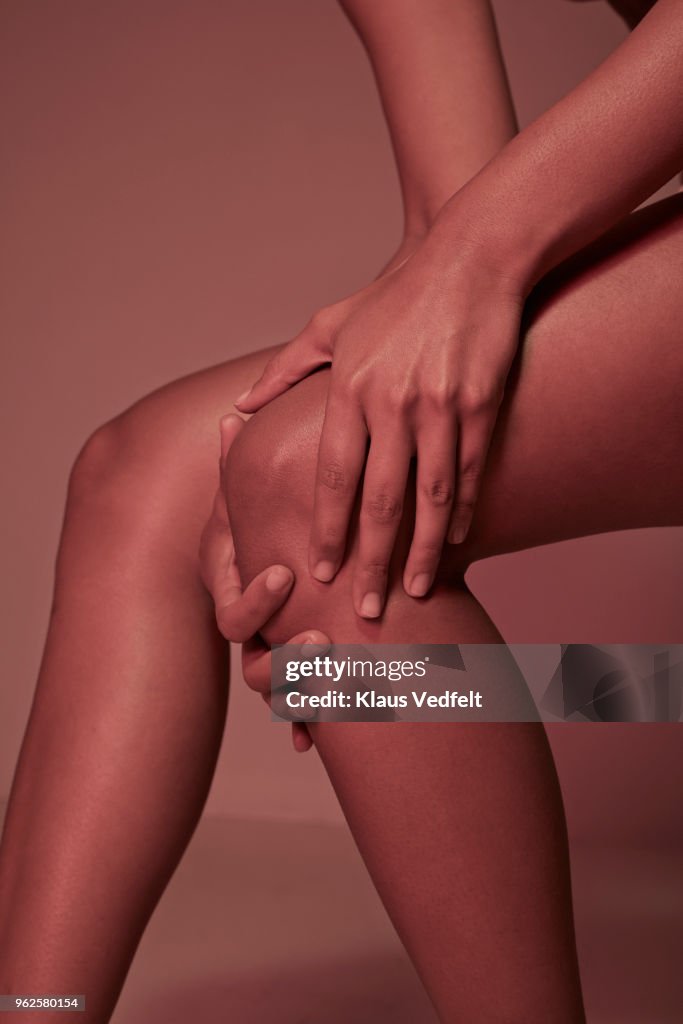 Cropped image of woman having knee pains