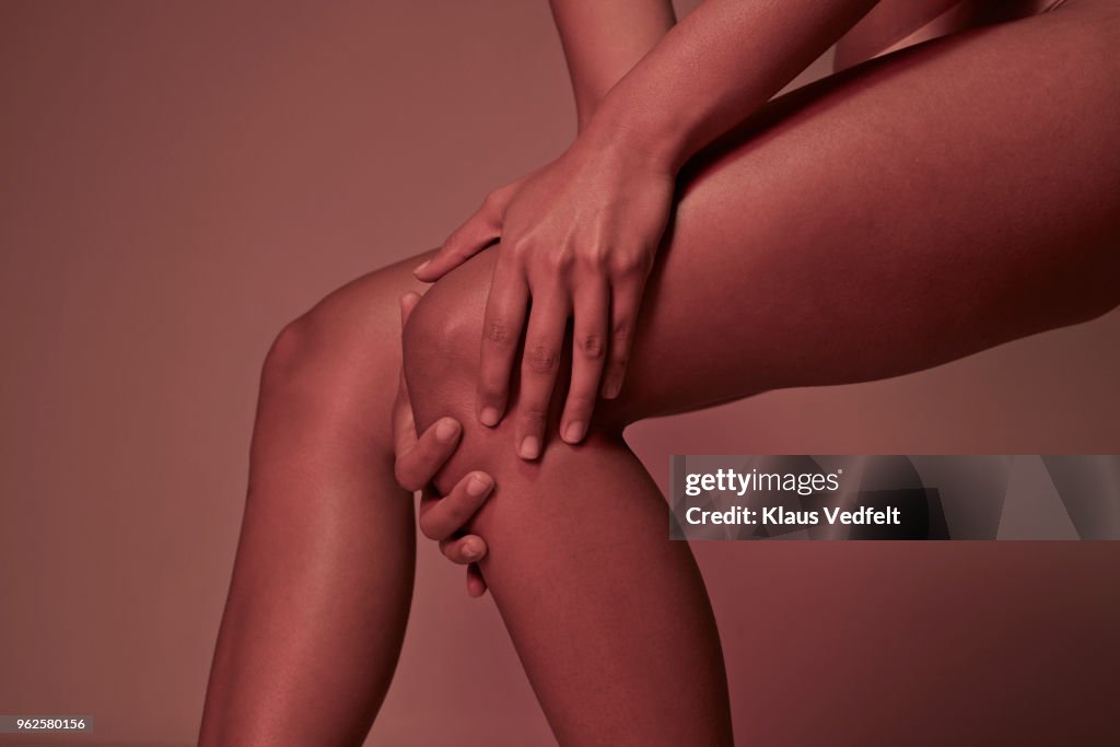 Cropped image of woman having knee pains