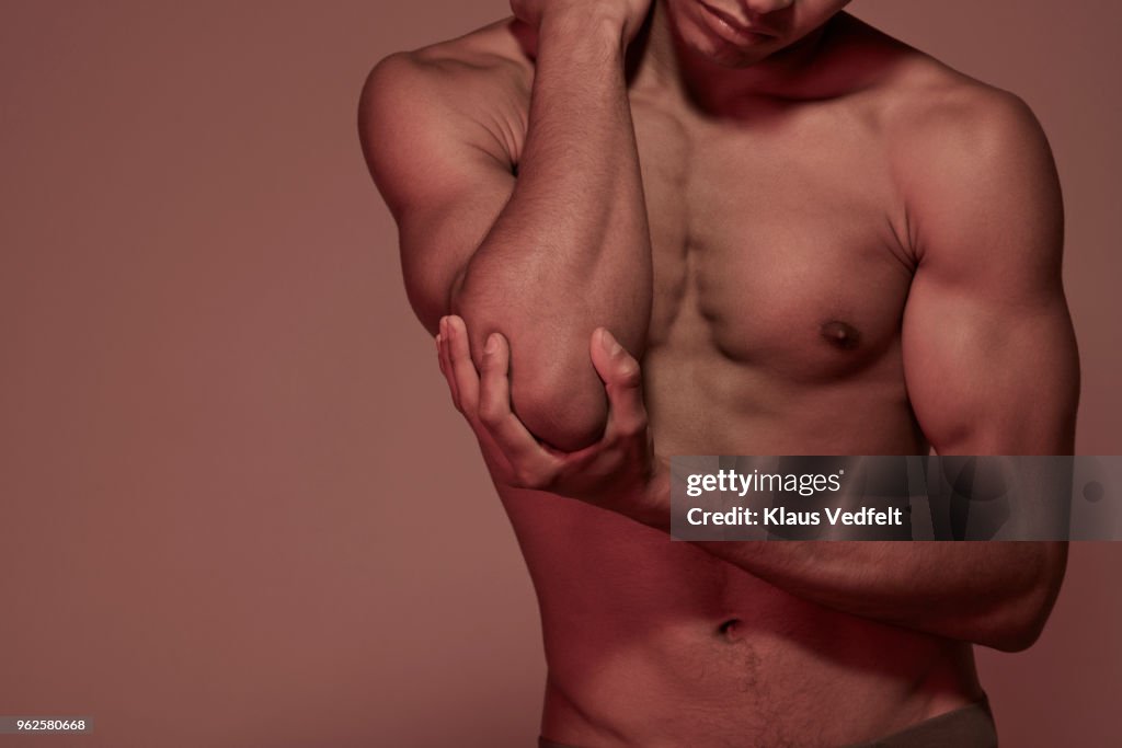 Young man having elbow pain