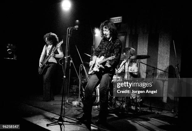 Rory Gallagher performs on stage at the Marquee Club, Gerry McAvoy, Rory Gallagher and Wilgar Campbell, in April 1972 in London.