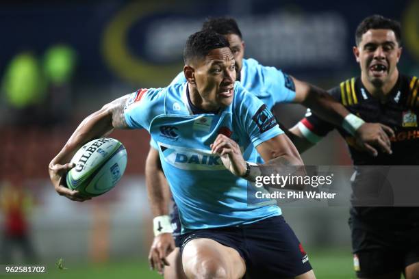 Israel Folau of the Waratahs makes a break during the round 15 Super Rugby match between the Chiefs and the Waratahs at FMG Stadium on May 26, 2018...