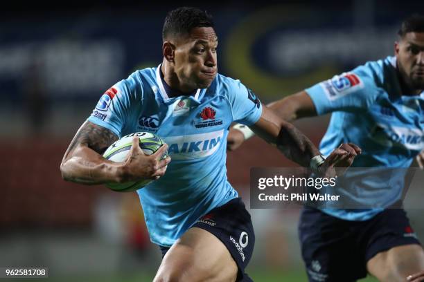 Israel Folau of the Waratahs makes a break during the round 15 Super Rugby match between the Chiefs and the Waratahs at FMG Stadium on May 26, 2018...