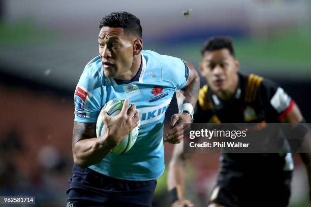 Israel Folau of the Waratahs makes a break during the round 15 Super Rugby match between the Chiefs and the Waratahs at FMG Stadium on May 26, 2018...