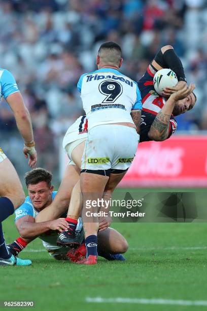 Jared Warea-Hargreaves of the Roosters is tackled during the round 12 NRL match between the Sydney Roosters and the Gold Coast Titans at Central...