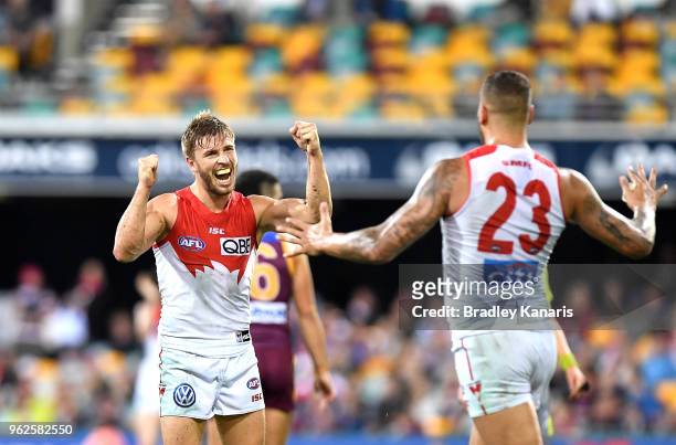 Kieren Jack of the Swans celebrates with team mate Lance Franklin after kicking a goal during the round 10 AFL match between the Brisbane Lions and...