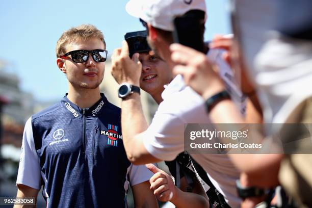 Sergey Sirotkin of Russia and Williams signs autographs for fans during previews ahead of the Monaco Formula One Grand Prix at Circuit de Monaco on...