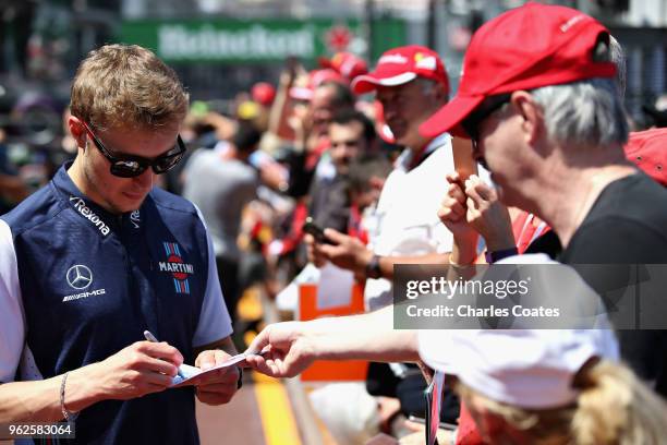 Sergey Sirotkin of Russia and Williams signs autographs for fans during previews ahead of the Monaco Formula One Grand Prix at Circuit de Monaco on...