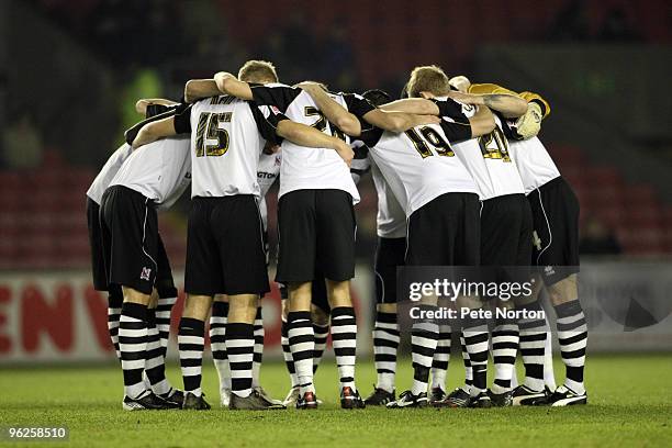 Darlington players Huddle prior to the Coca Cola League Two Match between Darlington and Northampton Town at the Northern Echo Darlington Stadium on...