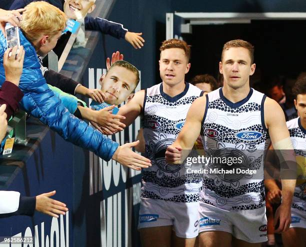 Joel Selwood of the Cats leads the team out during the round 10 AFL match between the Geelong Cats and the Carlton Blues at GMHBA Stadium on May 26,...