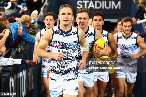 Joel Selwood of the Cats leads the team out during the round 10 AFL match between the Geelong Cats and the Carlton Blues at GMHBA Stadium on May 26,...