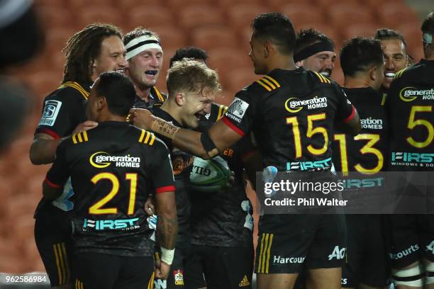 Damian McKenzie of the Chiefs celebrates his try during the round 15 Super Rugby match between the Chiefs and the Waratahs at FMG Stadium on May 26,...