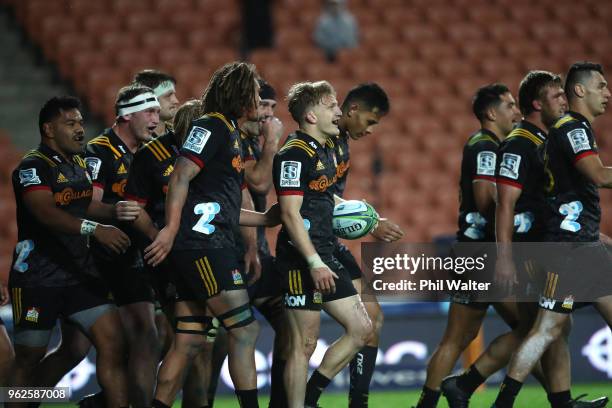 Damian McKenzie of the Chiefs celebrates his try during the round 15 Super Rugby match between the Chiefs and the Waratahs at FMG Stadium on May 26,...