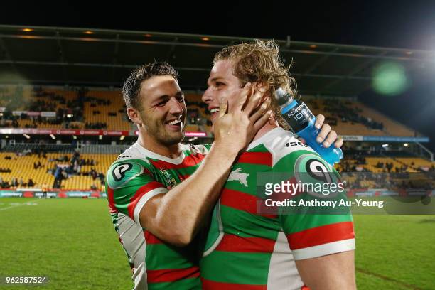 Sam Burgess of the Rabbitohs shares a laugh with his younger brother George Burgess after winning the round 12 NRL match between the New Zealand...