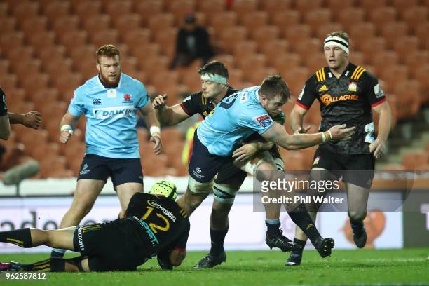Jed Holloway of the Waratahs is tackled during the round 15 Super Rugby match between the Chiefs and the Waratahs at FMG Stadium on May 26, 2018 in...