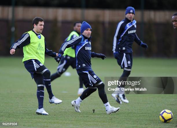 Joe Cole and Deco of Chelsea during a training session at the Cobham Training Ground on January 29, 2010 in Cobham, England.