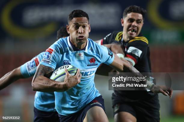 Israel Folau of the Waratahs makes a break during the round 15 Super Rugby match between the Chiefs and the Waratahs at FMG Stadium on May 26, 2018...