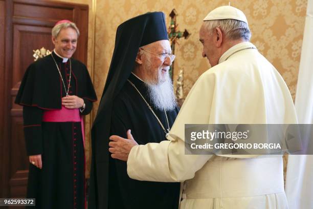 Pope Francis and Ecumenical Patriarch of Constantinople Bartholomew I hug each other during a private audience at the Vatican on May 26, 2018.