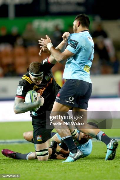 Brodie Retallick of the Chiefs is tackled during the round 15 Super Rugby match between the Chiefs and the Waratahs at FMG Stadium on May 26, 2018 in...