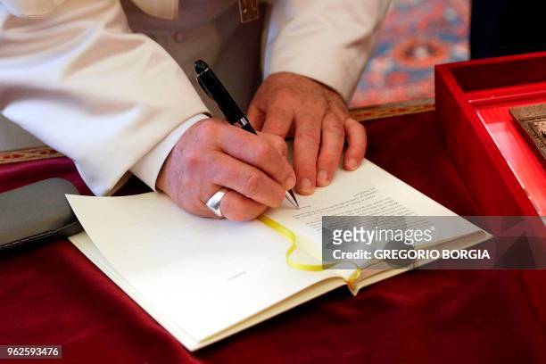 Pope Francis signs the Apostolic Exhortation "Gaudete et Exsultate" as he meets Bartholomew I , current Archbishop of Constantinople and Ecumenical...