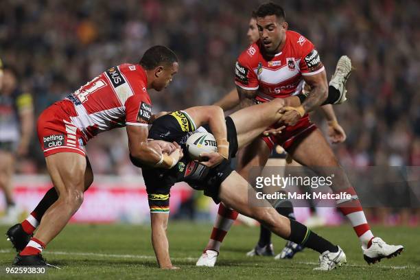 Isaah Yeo of the Panthers is tackled by Tyson Frizell and Paul Vaughan of the Dragons during the round 12 NRL match between the Penrith Panthers and...
