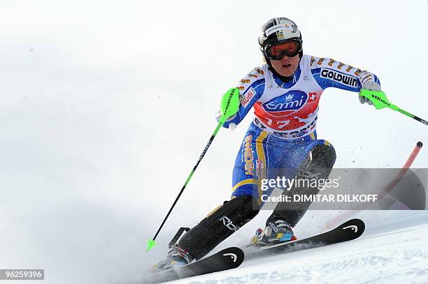 Anja Paerson of Sweden clears a gate during the slalom event of the Women's super combined at the FIS Alpine Skiing World Cup in Saint Moritz on...