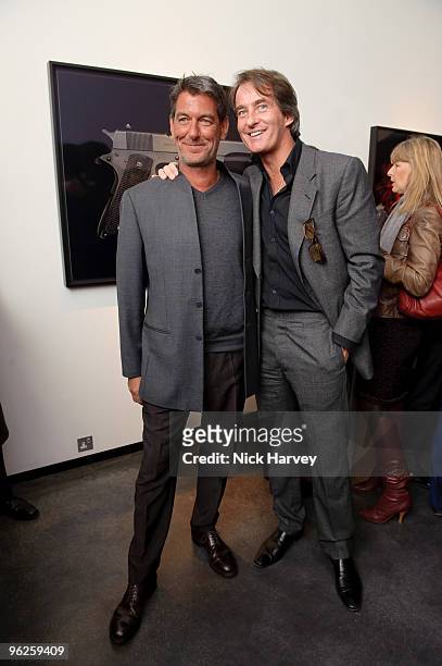 Guido Mocafico and Tim Jeffries attend private view of Guido Mocafico's 'Guns And Roses' on January 21, 2010 in London, England.