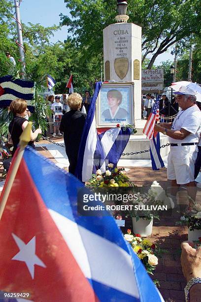 Supporters for Cuban shipwreck survivor Elian Gonzalez pray at a memorial for his mother, Elizabeth Broton, which was set up at the Bay of Pigs...