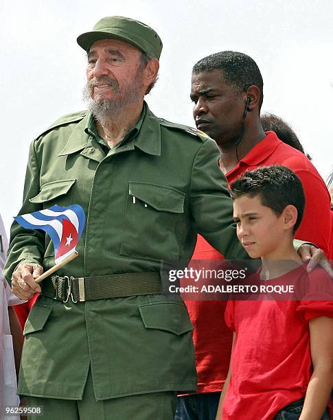 Cuban President Fidel Castro poses with shipwreck survivor Elian Gonzalez, after presiding over a massive May Day demonstration at Havana's Plaza de...