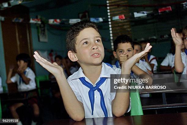 Cuban shipwreck survivor Elian Gonzalez plays with schoolmates 06 December at the Marcelo Salado School in Cardenas, Cuba, during a celebration for...
