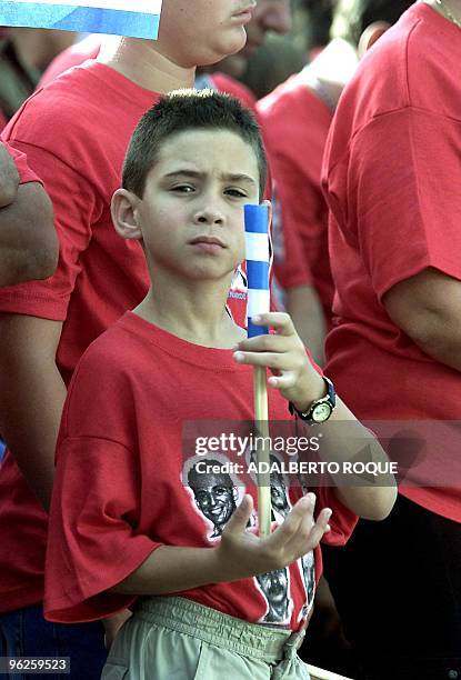 Cuban boy Elián González participates in a protest 25 May 2002 during a speech by Cuban President Fidel Castro in Sancti-Spiritus, some 340 km east...