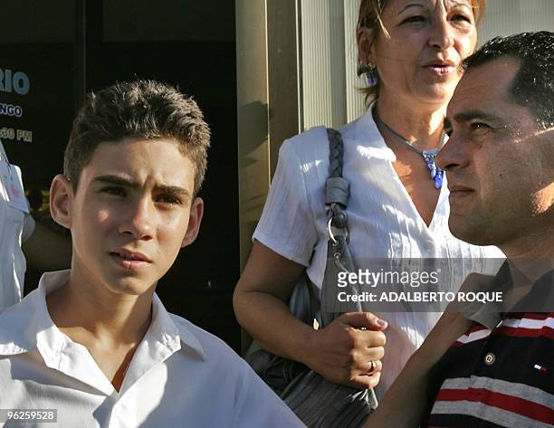 Cuban "balsero" child Elian Gonzalez and his father Juan Miguel Gonzalez take part 06 December, 2006 in Cardenas, 150 km east from Havana in a...