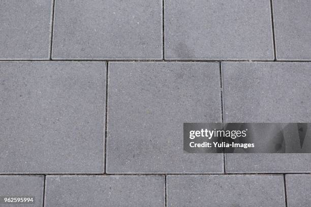 textured grey square tiles for paving - building atrium bildbanksfoton och bilder