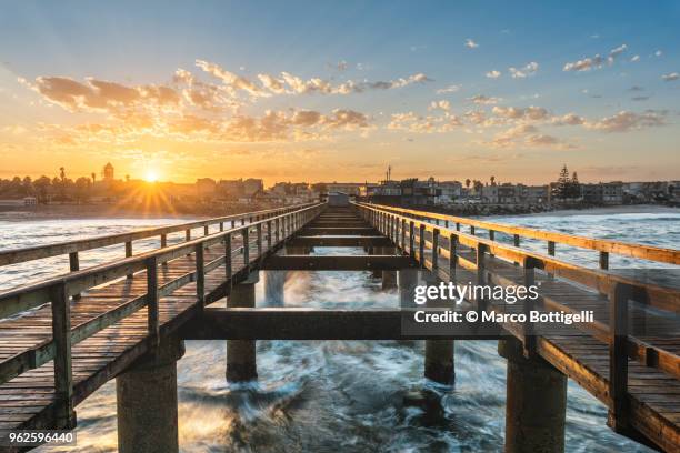 swakopmund pier at sunrise - footbridge stock pictures, royalty-free photos & images
