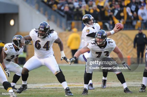 Offensive linemen Oniel Cousins and Marshal Yanda of the Baltimore Ravens block for quarterback Joe Flacco during a game against the Pittsburgh...