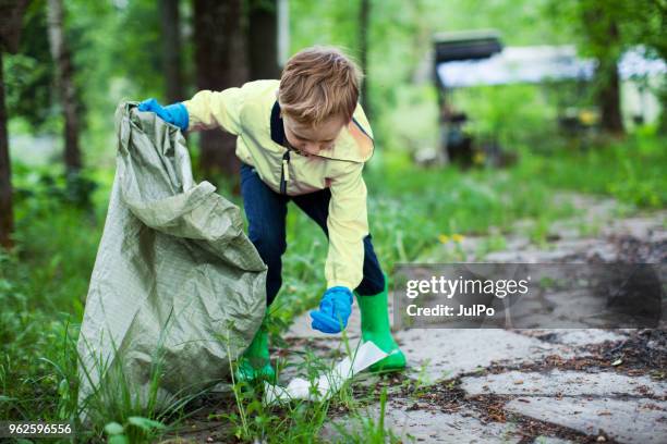 environmental cleanup - picking up garbage stock pictures, royalty-free photos & images