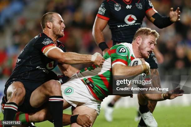 Tom Burgess of the Rabbitohs scores a try against Simon Mannering of the Warriors during the round 12 NRL match between the New Zealand Warriors and...