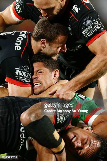 Dane Gagai of the Rabbitohs is tackled by Simon Mannering, Blake Green and James Gavet of the Warriors during the round 12 NRL match between the New...