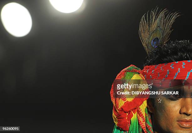 An Indian model walks the ramp as he presents a creation of designer Sharad Raghav during the second day of the Bangalore Fashion Week in Bangalore...