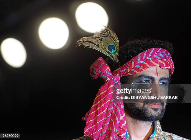 An Indian model walks the ramp as he presents a creation of designer Sharad Raghav during the second day of the Bangalore Fashion Week in Bangalore...