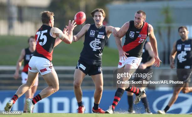 Sam Fisher of the Blues and Matthew Leuenberger of Essendon compete for the ball during the round eight VFL match between the Northern Blues and...