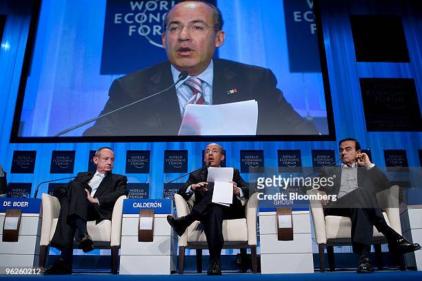 Felipe Calderon, president of Mexico, center, and Carlos Ghosn, president and chief executive officer of Nissan Motor Co., right, participate in a...