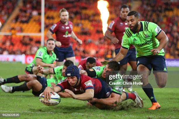 Hamish Stewart of the Reds dives to score a try during the round 15 Super Rugby match between the Reds and the Highlanders at Suncorp Stadium on May...