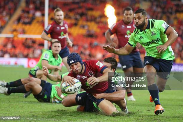 Hamish Stewart of the Reds dives to score a try during the round 15 Super Rugby match between the Reds and the Highlanders at Suncorp Stadium on May...