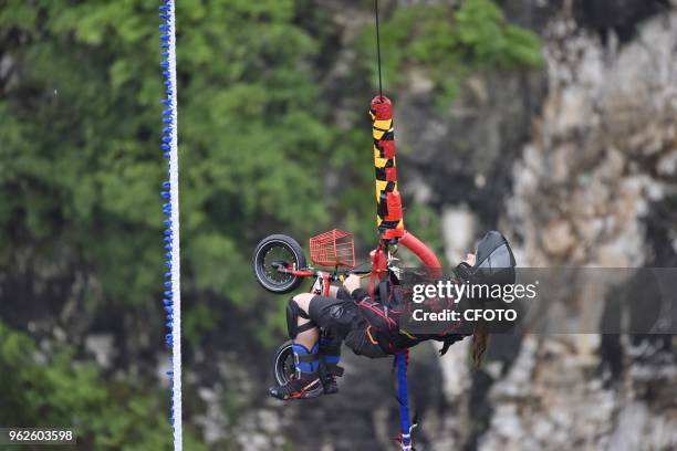 Jumpers from different countries join a fancy bungee jumping competition held at the Zhangjiajie Grand Canyon in Zhangjiajie, China's Hunan province,...