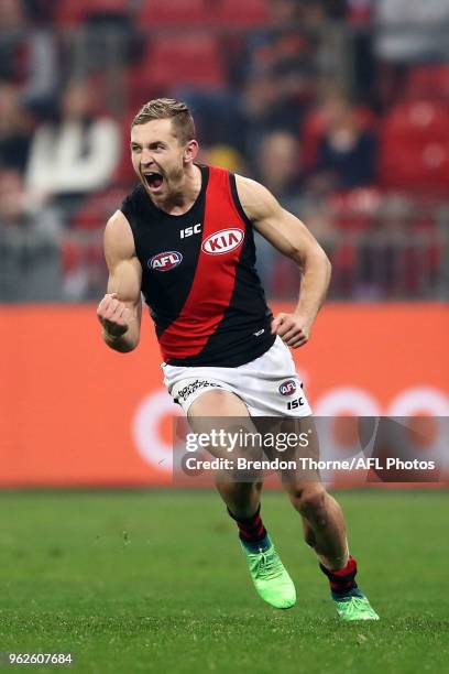 Devon Smith of the Bombers celebrates kicking a goal during the round 10 AFL match between the Greater Western Sydney Giants and the Essendon Bombers...